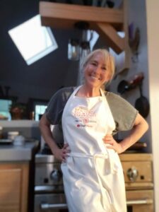 Marsha in a white apron